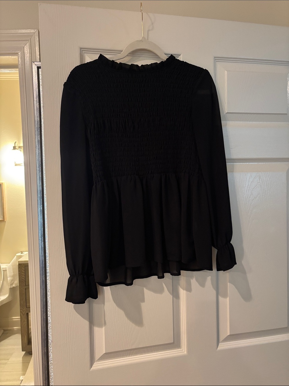 Black Smocked Peplum Long-Sleeve Top